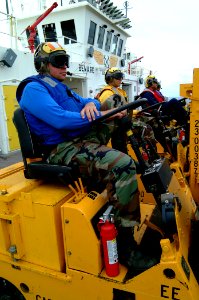 US Navy 050408-N-0357S-021 Air Department personnel await the start of vertical replenishment operations on the flight deck aboard the Military Sealift Command (MSC) hospital ship USNS Mercy (T-AH 19)