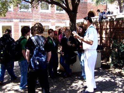 US Navy 050330-N-8110K-047 Musician 3rd Class Ken Nieves, a member of the U.S. Navy 6-piece rock band, New Orleans Express, talks with Arlington Heights High School students