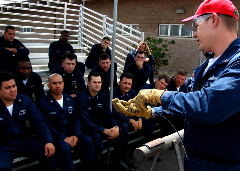 US Navy 050331-N-3019M-001 Sailors assigned to the guided missile frigate USS Crommelin (FFG 37) receive training on pipe patching techniques