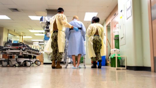 USNS Mercy Sailors Walk Alongside Patient (49834023051)