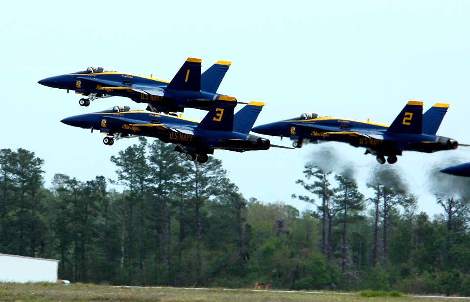 US Navy 050416-N-0295M-086 Four F-A-18A Hornets, assigned to the U.S. Navy flight demonstration team, the Blue Angels, takeoff in a tight formation during the 2005 Coastal Carolina Air Show in Wilmington, N.C