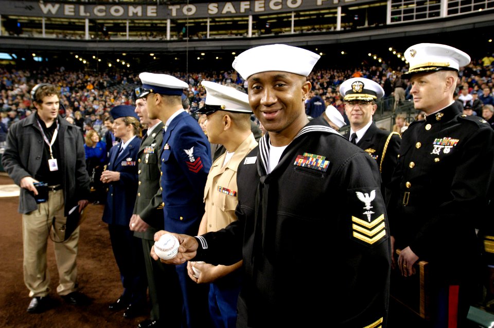 US Navy 050405-N-6477M-340 Hospital Corpsman 1st Class Jermaine K. Williams, assigned to Naval Hospital Bremerton, Wash., prepares to take the field to throw the first pitch during the Boeing Salute to Armed Forces Night at SAF