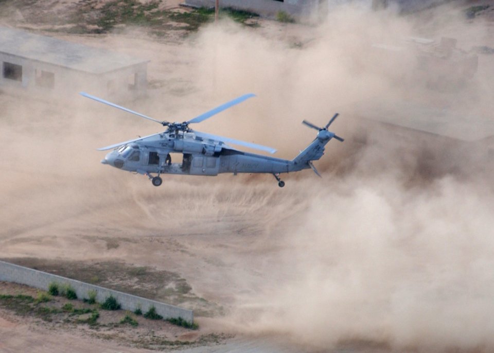 US Navy 050517-N-9500T-101 An MH-60S Seahawk helicopter assigned to Helicopter Sea Combat Squadron Two One (HSC-21) prepares to land during a training mission at Marine Corps Base Camp Pendleton