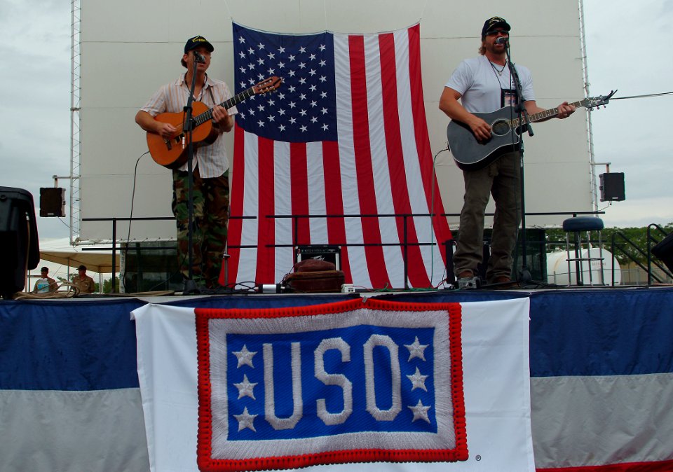 US Navy 050512-N-0962S-214 Two-time consecutive Academy of Country Music Entertainer of the Year Toby Keith and songwriting partner Scotty Emerick play for service members at the Lyceum Theater