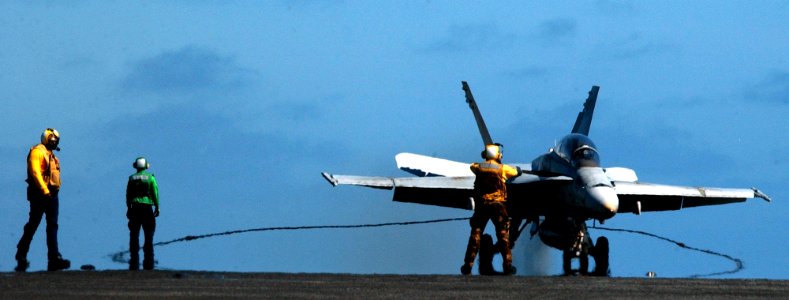 US Navy 050518-N-7130B-140 An F-A-18C Hornet makes an arrested landing on the flight deck aboard the Nimitz-class aircraft carrier USS Ronald Reagan (CVN 76)