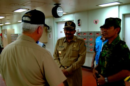 US Navy 050411-N-0357S-033 Commander, Task Force Group 73.1, Commodore Timothy McCully, left, welcomes the Governor for North Sumatra, Rizal Nurdin, center, to the Military Sealift Command (MSC) hospital ship USNS Mercy (T-AH 1