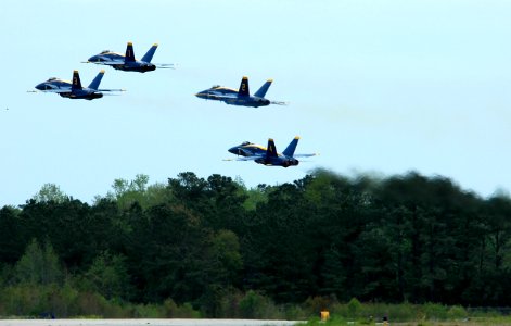 US Navy 050416-N-0295M-089 Four F-A-18A Hornets, assigned to the U.S. Navy flight demonstration team, the Blue Angels, takeoff in a tight formation during the 2005 Coastal Carolina Air Show in Wilmington, N.C