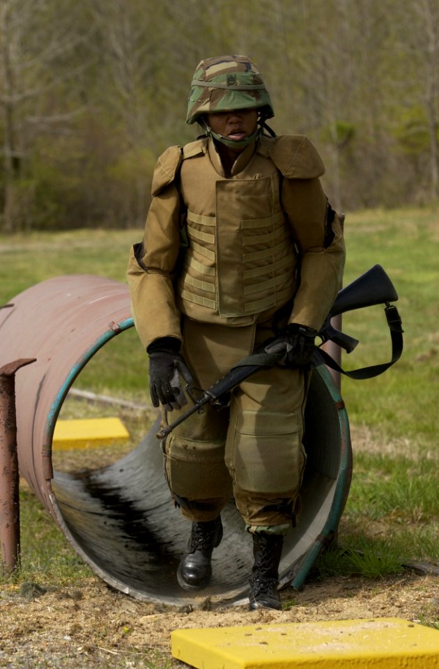 US Navy 050425-N-7676W-117 Staff Sgt. Leslie Moore assigned to the 16th Ordinance Battalion tests new flexible arm and leg protective armor