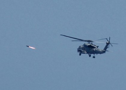 US Navy 050427-N-7512V-006 An HH-60H Seahawk helicopterfires an AGM-114B Hellfire missile at a weapons training site off the coast of Okinawa