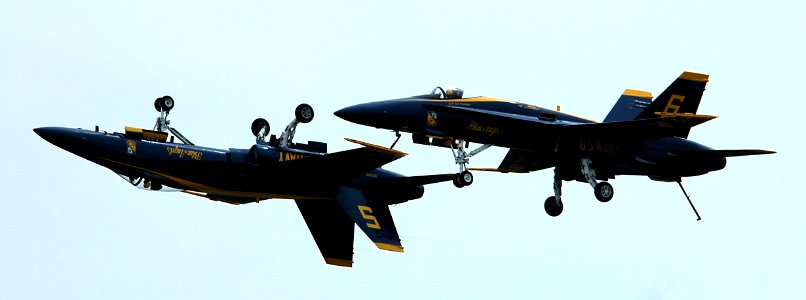 US Navy 050416-N-0295M-176 The Lead and Opposing Solo pilots, assigned to the U.S. Navy Blue Angels flight demonstration team, perform a maneuver in their F-A-18A Hornets at the 2005 Coastal Carolina Air Show