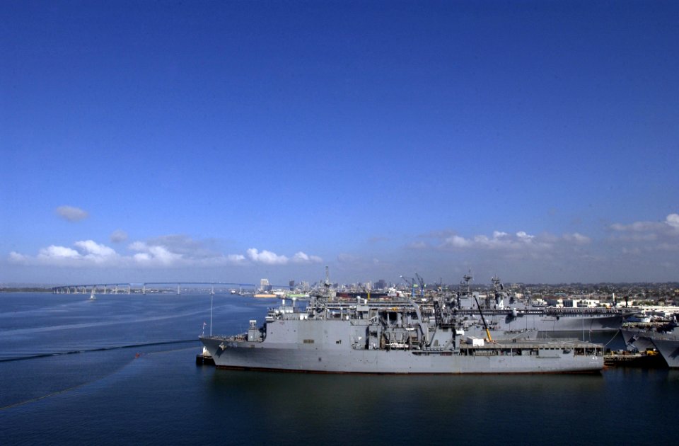US Navy 050330-N-9866B-003 The amphibious dock landing ship USS Comstock (LSD 45), foreground, and other U.S. Navy vessels sit in port on board Naval Station San Diego, Calif
