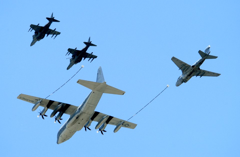 US Navy 050507-N-0295M-021 A KC-130J Hercules simulates aerial refueling with an EA-6B Prowler and two AV-8B Harrier II aircraft at the conclusion of the Marine Air Ground Task Force