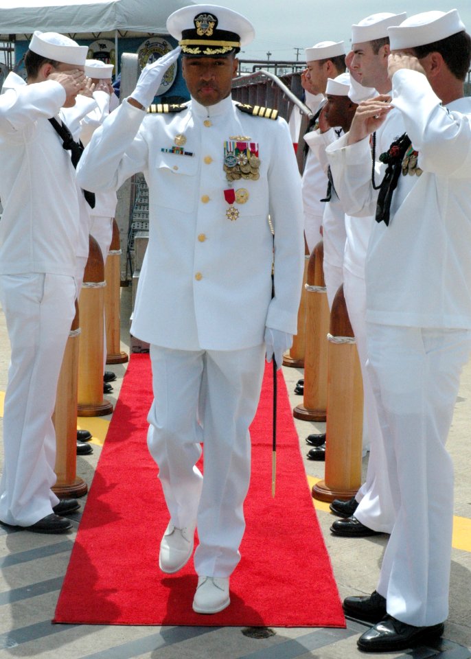 US Navy 050513-N-2820Z-003 Capt. Bruce E. Grooms salutes the sideboys as he steps off the Los Angeles class submarine USS Norfolk (SSN 714)