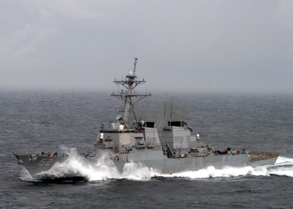 US Navy 050402-N-6363M-034 Waves crash over the bow of the Arleigh-Burke-class guided missile destroyer USS Barry (DDG 52) as she plows through heavy seas while underway in the Mediterranean Sea
