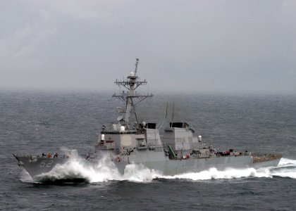 US Navy 050402-N-6363M-034 Waves crash over the bow of the Arleigh-Burke-class guided missile destroyer USS Barry (DDG 52) as she plows through heavy seas while underway in the Mediterranean Sea