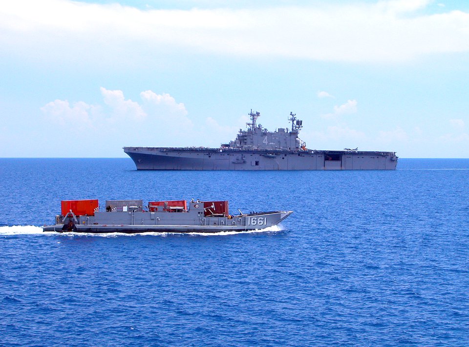 US Navy 050509-N-1464F-102 Landing Craft Utility (LCU) 1661 approaches the amphibious assault ship USS Nassau (LHA 4) in the Caribbean Sea during the backload of equipment and personal from New Horizons Haiti 2005