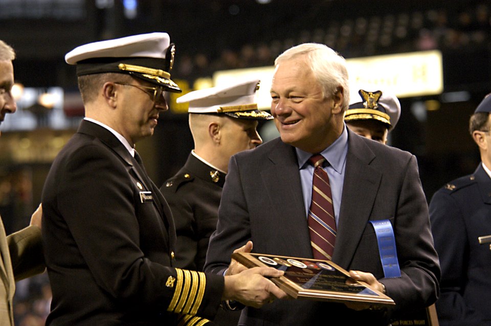 US Navy 050405-N-6477M-111 Capt. Robert D. Schlesinger represents the Navy Region Northwest as he receives a plaque of appreciation from President and Chief Operating Officer of the Seattle Mariners Baseball Team