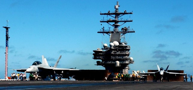 US Navy 050518-N-7130B-153 An F-A-18F Super Hornet launches from the flight deck aboard the Nimitz-class aircraft carrier USS Ronald Reagan (CVN 76) as another is readied for launch