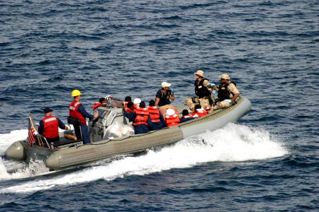 US Navy 050429-N-0000X-001 A rigid hull inflatable boat carry survivors rescued from the Gulf of Aden to the coastal patrol ship USS Firebolt (PC 10) after their small vessel capsized 25 miles off the coast of Somalia