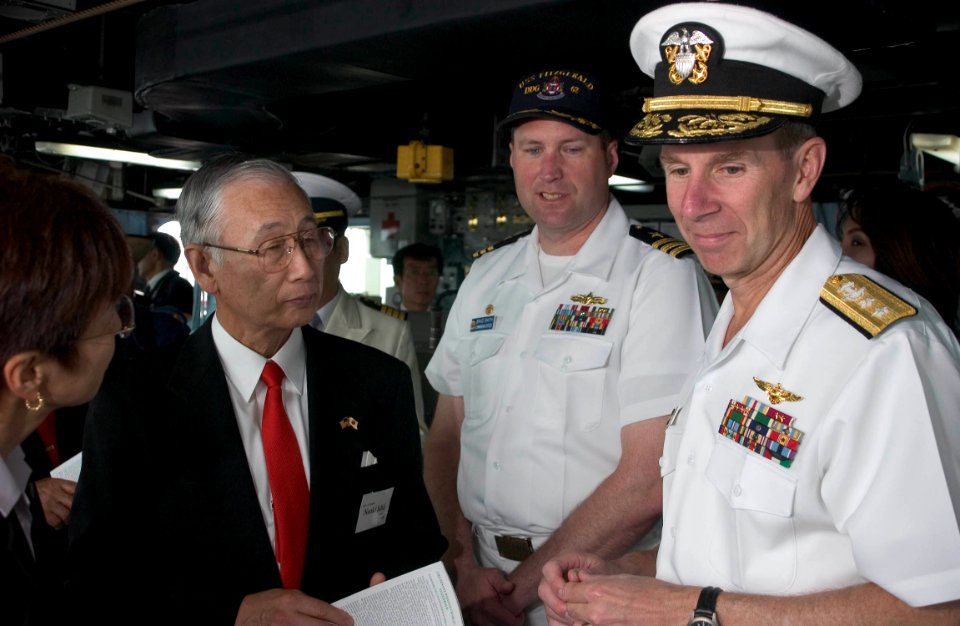 US Navy 050520-N-9851B-006 Commander Brad Smith, center, explains operations on the bridge of USS Fitzgerald to Mayor of Shimoda City, Mr. Naoki Ishii, and Commander Naval Forces Japan Rear Admiral Frederic Ruehe