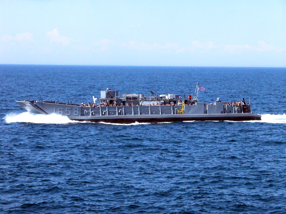 US Navy 050529-N-9543M-048 Sea Cadets from upstate New York get a ride aboard a Landing Craft Utility vehicle while touring the dock landing ship USS Shreveport (LPD 12)