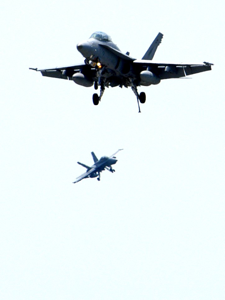 US Navy 050507-N-0295M-023 Two F-A-18D Hornets, assigned to the Knighthawks of Marine Fighter Attack Squadron Five Three Three (VMFA-533), prepare to land at the conclusion of the Marine Air Ground Task Force (MAGTF) demonstrat