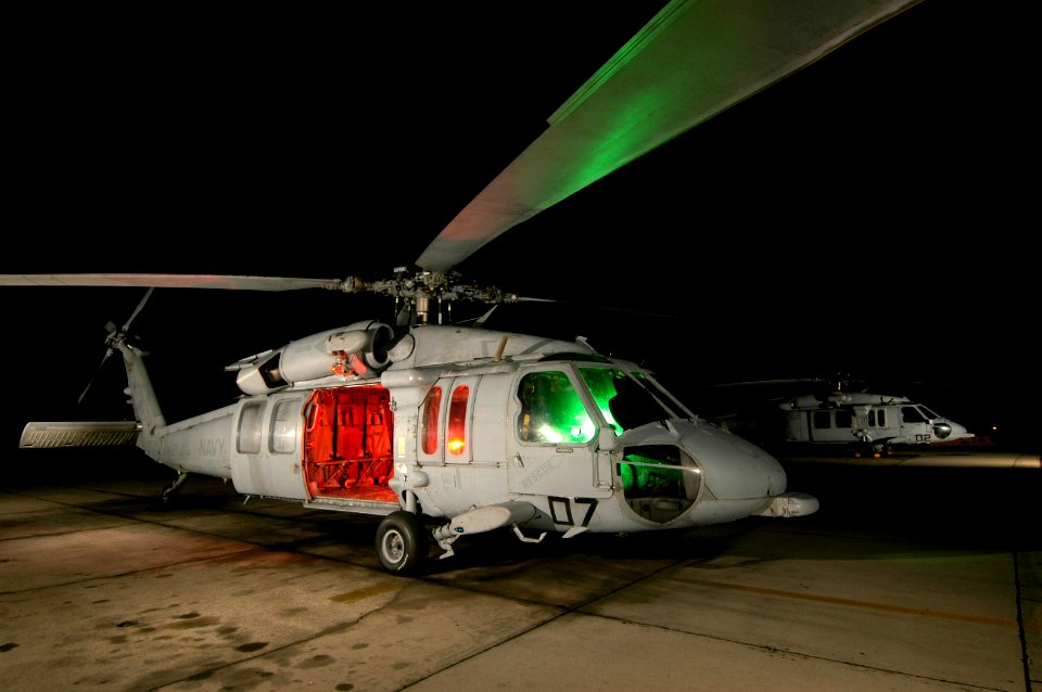 US Navy 050531-N-0000X-086 Photographers practiced a new Nikon Creative Lighting System while photographing an SH-60 helicopter from Helicopter Sea Combat Squadron Three (HSC-3), at Naval Air Station North Island