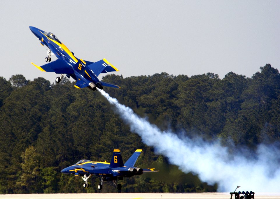 US Navy 050507-N-0295M-058 Lead Solo, Lt. Cmdr. Craig R. Olson, assigned to the U.S. Navy flight demonstration team, the Blue Angels, pulls his F-A-18A Hornet up sharply as the Opposing Solo