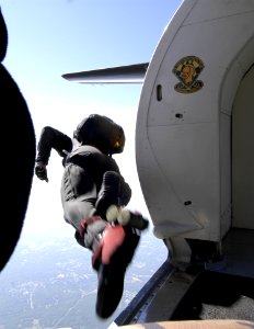 US Navy 050521-N-0295M-009 A member of the U.S. Army Parachute Team, the Golden Knights, jumps out of the team's C-31 jump plane at 12,500 feet above Andrews Air Force Base during the 2005 Joint Service Open House