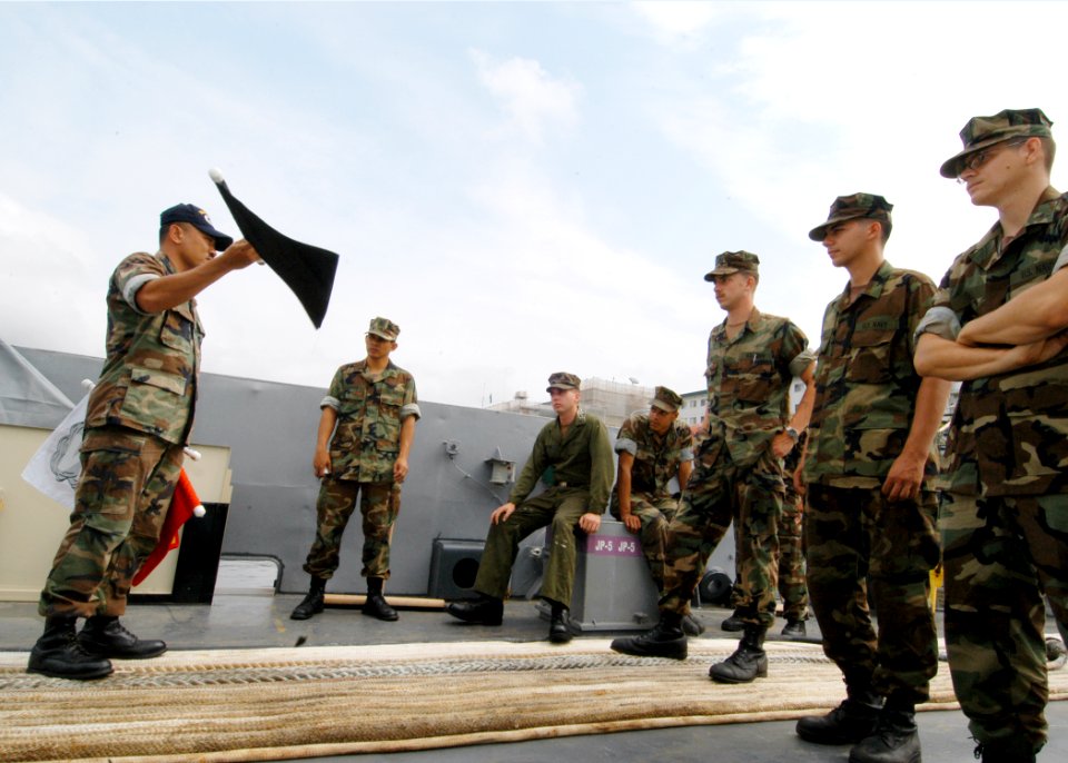 US Navy 050603-N-2385R-037 Chief Engineman Bayani Salenga assigned to Assault Craft Unit One (ACU-1), trains Sailors on what to expect during General Quarters (GQ) drill