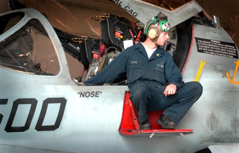 US Navy 050607-N-5134J-002 Aviation Structural Mechanic Airman Brandon Davis, assigned to the Rooks of Electronic Attack Squadron One Three Seven (VAQ-137) electronically lowers and raises the EA-6B's flaps and sl
