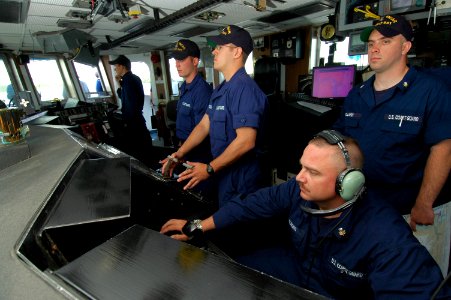 US Navy 050516-C-3292S-510 Crew members of the Coast Guard Cutter Bear (WMEC-901) stands watch on the bridge