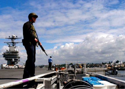 US Navy 050523-N-9079D-006 Aviation Ordnanceman 3rd Class Stewart Blakeslee stands the Flight Deck Rover Watch aboard the Nimitz-class aircraft carrier USS Abraham Lincoln (CVN 72)