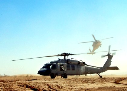 US Navy 050525-N-9500T-141 Two MH-60S Seahawk helicopters assigned to Helicopter Sea Combat Squadron Three (HSC-3), practice division landings in a landing area near Naval Air Facility El Centro, Calif