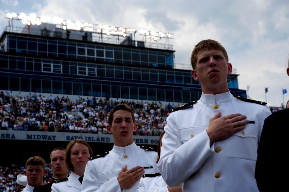 US Navy 050527-N-0295M-007 Newly commissioned Ensigns and Second Lieutenants sing the U.S. Naval Academy alma mater Navy Blue And Gold