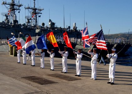 US Navy 050520-N-0780F-008 Storekeeper First Class Lonnie Campton, assigned to USS Taylor (FFG 50), serves as color guard for the American flag during the opening ceremony of the North Atlantic Council (NAC) and the Military Co