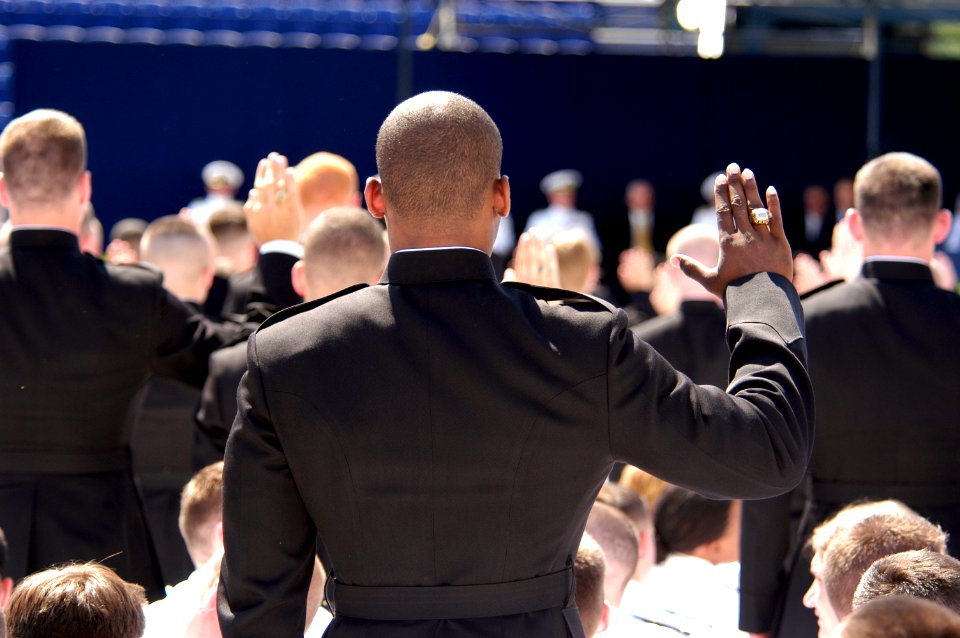 US Navy 050527-N-0295M-005 Newly commissioned 2nd Lieutenants in the Marine Corps take the oath of office, administered by the Assistant Commandant of the Marine Corps, Gen. William L. Nyland