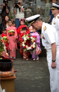 US Navy 050520-N-9851B-016 Commander Naval Forces Japan, Rear Admiral Frederic Ruehe bows after laying a wreath during a memorial ceremony for Sailors who died on Commodore Matthew Perry's journey to Japan
