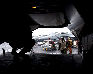 US Navy 050616-N-0000P-007 Sailors aboard the conventionally powered aircraft carrier USS Kitty Hawk (CV 63) prepare to unload a C-2A Greyhound after landing aboard the ship
