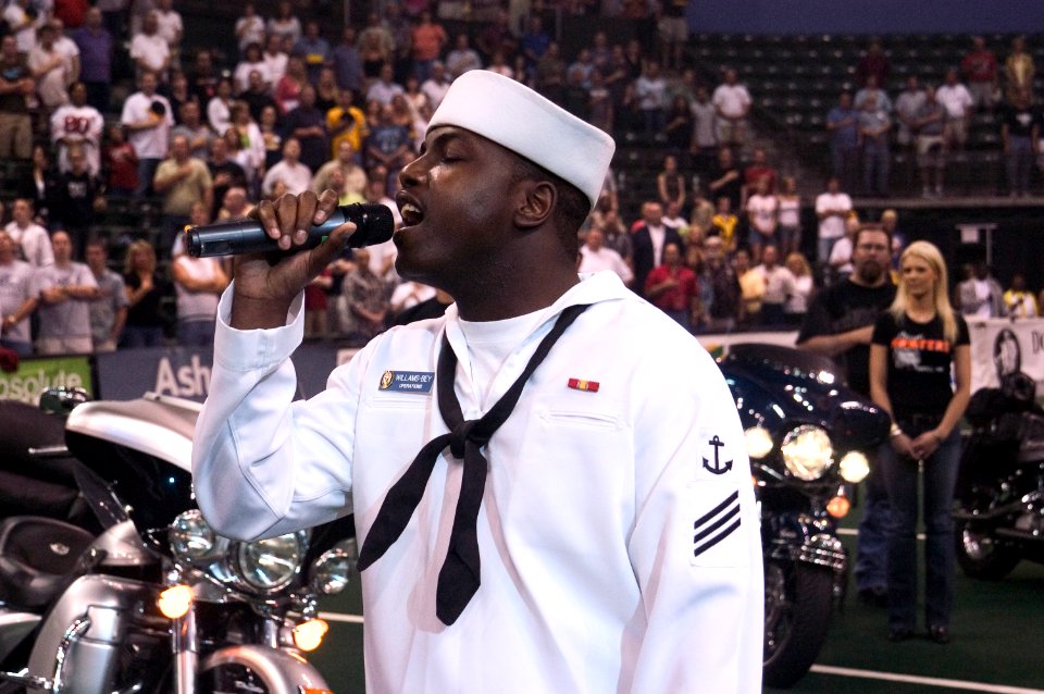 US Navy 050527-N-3390M-025 Personnelman Seaman Keith Williams-Bey, assigned to the guided missile frigate USS Ford (FFG 54), sings the National Anthem
