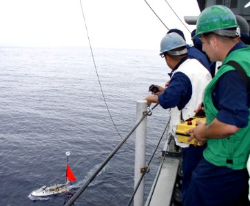 US Navy 050527-N-4104L-001 Aviation Support Equipment Technician 3rd Class Nick Regalbuto, assigned to Commander, Fleet Activities Okinawa, Targets, uses a mobile operating system to launch a Roboski Shipboard Deployable Surfac