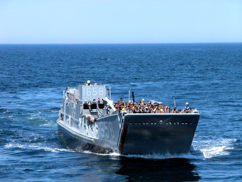 US Navy 050529-N-9543M-052 Sea Cadets from upstate New York get a ride aboard a Landing Craft Utility vehicle while touring the dock landing ship USS Shreveport (LPD 12)