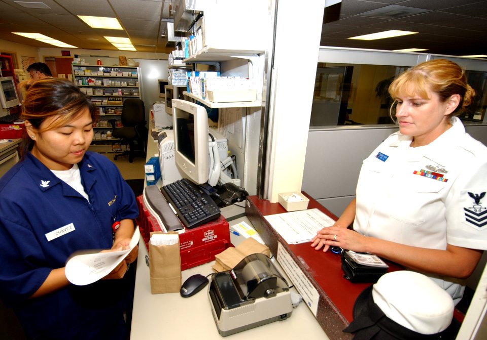 US Navy 050617-N-9500T-045 Hospital Corpsman 3rd Class Kathleen Chaves, assigned to Branch Medical Clinic, Naval Training Center San Diego, issues prescribed medications to patients