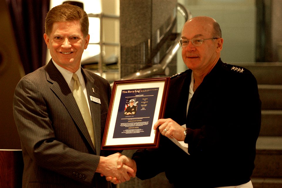 US Navy 050525-N-0295M-001 President and Chief Executive Officer of the U.S. Navy Memorial Foundation, Retired Rear Adm. Richard A. Buchanan, presents Chief of Naval Operations, Adm. Vern Clark, a framed copy of his U.S. Navy L