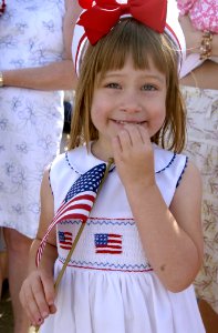 US Navy 050606-N-9866B-010 A young girl anxiously waits for the arrival of her father, a Sailor aboard the amphibious dock landing ship USS Duluth (LPD 6)