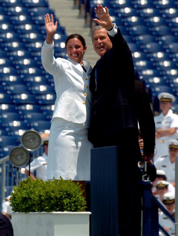 US Navy 050527-N-9693M-025 President of the United State, George W. Bush waves to the parents of Midshipman Shannon Lynne Bailey, left, moments prior to receiving her degree in Oceanography from the U.S. Naval Academy