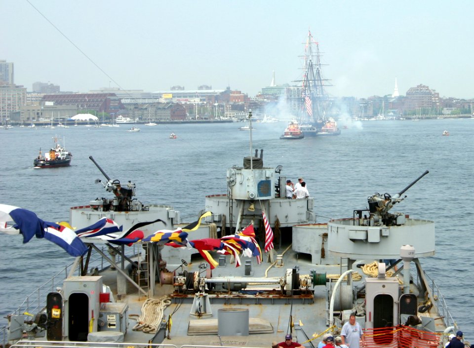 US Navy 050611-N-8110K-137 LST 325, a vintage World War II tank landing ship, follows USS Constitution, Old Ironsides, as they make their way into Boston Harbor