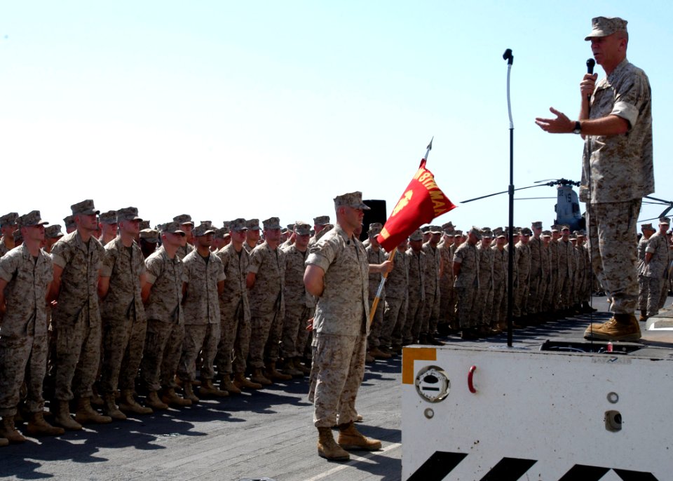 US Navy 050617-N-5313A-030 Commandant of the Marine Corps, Gen. Michael Hagee, addresses Marines and Sailors on the flight deck aboard the amphibious assault ship USS Kearsarge (LHD 3)