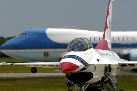 US Navy 050521-N-0295M-025 Air Force One taxis behind a F-16C Fighting Falcon belonging to the U.S. Air Force Air Demonstration Squadron, Thunderbirds, prior to takeoff from Andrews Air Force Base, Md., during the 2005 Joint Se photo