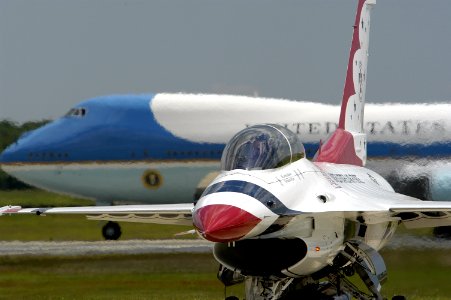 US Navy 050521-N-0295M-025 Air Force One taxis behind a F-16C Fighting Falcon belonging to the U.S. Air Force Air Demonstration Squadron, Thunderbirds, prior to takeoff from Andrews Air Force Base, Md., during the 2005 Joint Se